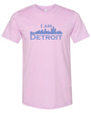 Lilac colored short sleeve t-shirt with large purple I Am Detroit logo printed across the chest