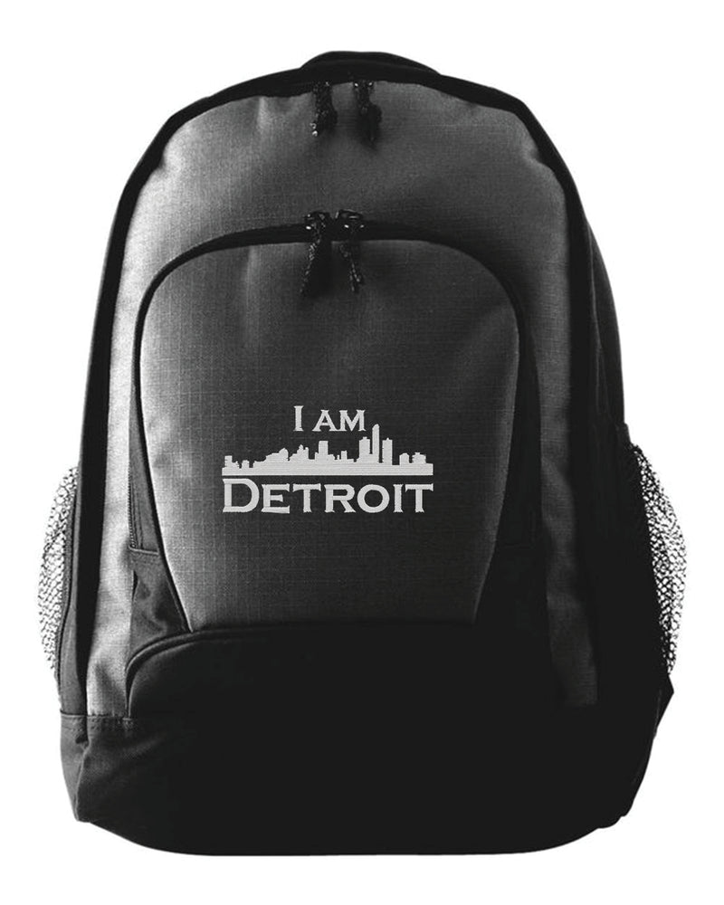 Black Backpack with gray stitched IAD logo embroidered on the front flap of smaller pouch.