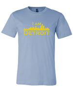 Baby blue short sleeve t-shirt with large yellow I Am Detroit logo printed across the chest