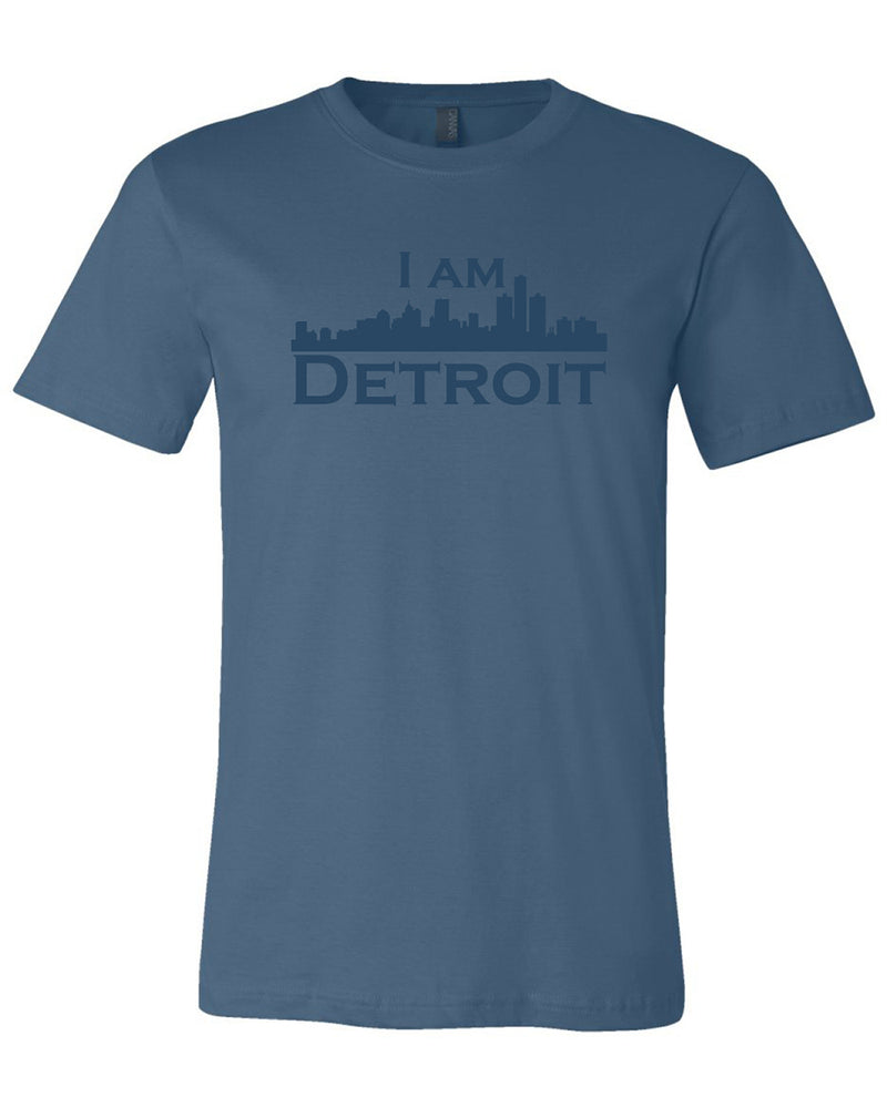 Steel navy colored short sleeve t-shirt with large steel navy colored I Am Detroit logo printed across the chest