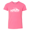 Vibrant pink youth sized short sleeve t-shirt with large white I Am Detroit logo printed across the chest